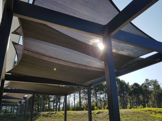 Multi Shade Sail installation above timber frame by Covered Whangamata NZ using E32 Shade Cloth